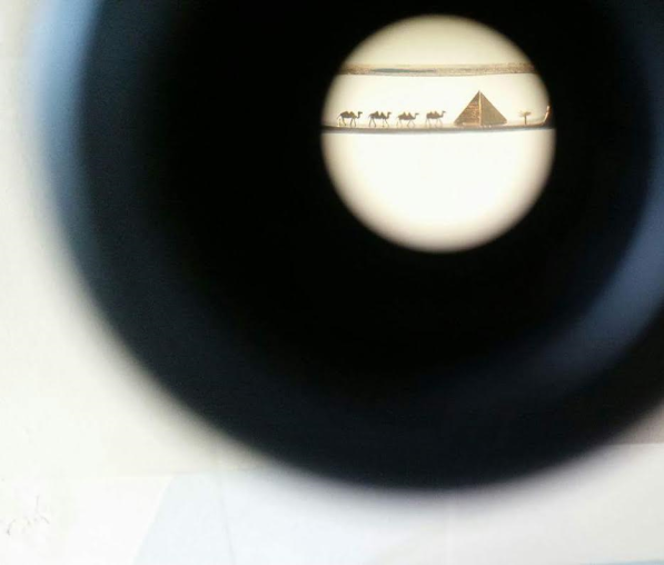a pyramid with 4 camels composition placed in the eye of an needle, Photo: Leanne White
